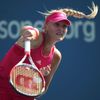 Kristina Mladenovic of France hits a return to Petra Kvitova of the Czech Republic during their match at the 2014 U.S. Open tennis tournament in New York