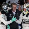 Second placed Mercedes Formula One driver Rosberg shakes hands with race winner and team mate Hamilton in the Parc Ferme after the Australian F1 Grand Prix in Melbourne