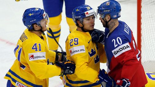 Jakub Klepis of the Czech Republic (R) argues with Sweden's Erik Gustafsson (C) and Gustav Nyquist (L) during the first period of their men's ice hockey World Championshi