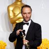 Emmanuel Lubezki poses with his award for best cinematography for his film &quot;Gravity&quot; at the 86th Academy Awards in Hollywood, California