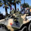 Cast members Arnold Schwarzenegger, Jason Statham and Harrison Ford pose on a tank as they arrive on the Croisette to promote the film &quot;The Expendables 3&quot; during the 67th Cannes Film Festiva