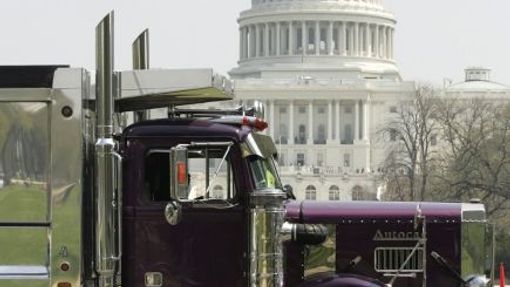 A truck passes the U.S. Capitol during a caravan of trucks protesting gas prices, in Washington April 10, 2008. According to reports, more than 100 trucks circled the U.S. Capitol honking their horns on Thursday during the gas price protest. REUTERS/Molly Riley (UNITED STATES)