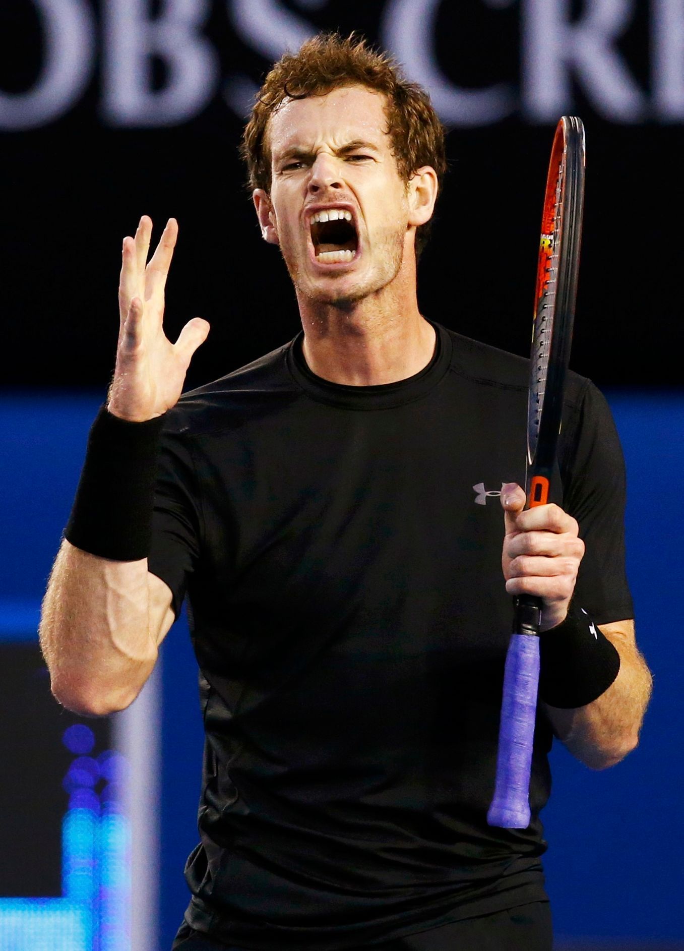 Murray of Britain reacts after hitting a shot against Djokovic of Serbia during their men's singles final match at the Australian Open 2015 tennis tournament in Melbourne