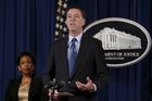 FBI Director James Comey speaks next to U.S. Attorney General Loretta Lynch at a news conference at the Justice Department in Washington