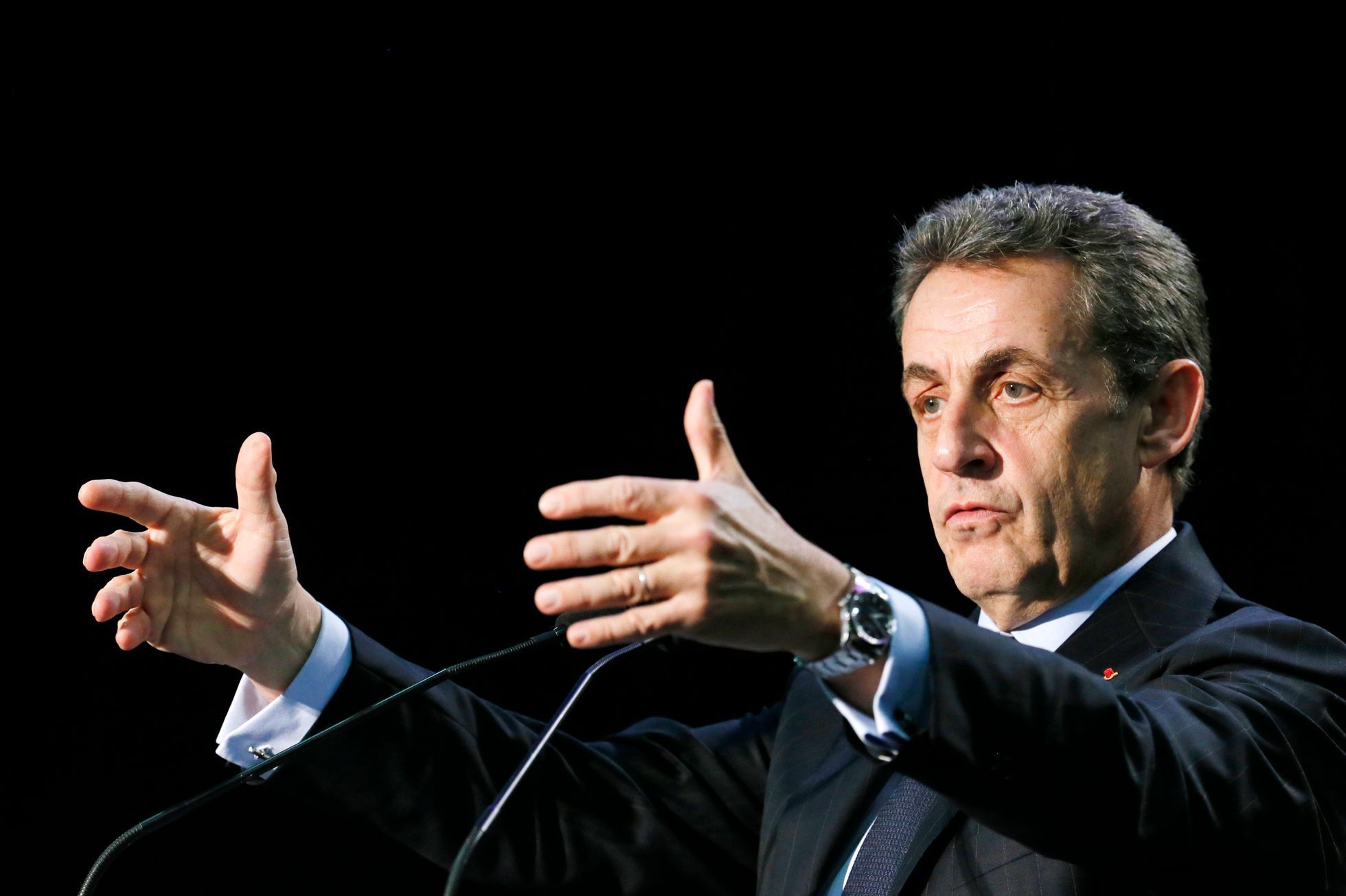 Nicolas Sarkozy, former French president and current UMP conservative political party head, attends a political rally as he campaigns for French departmental elections in Palaiseau