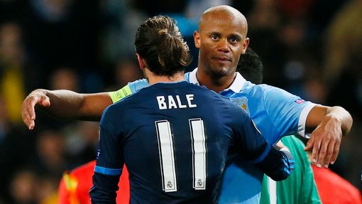 Real Madrid's Gareth Bale with Manchester City's Vincent Kompany at the end of the match