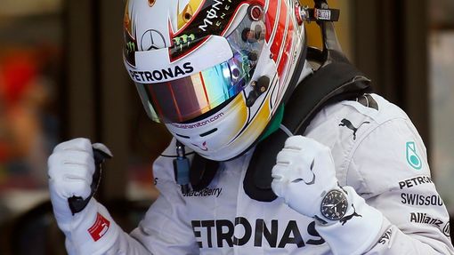 Mercedes Formula One driver Lewis Hamilton of Britain celebrates after taking the pole position at the qualifying session of the Spanish F1 Grand Prix at the Barcelona-Ca