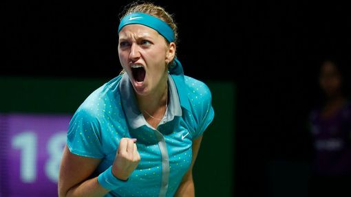 Petra Kvitova of the Czech Republic celebrates a point against Maria Sharapova of Russia during their WTA Finals singles tennis match at the Singapore Indoor Stadium Octo