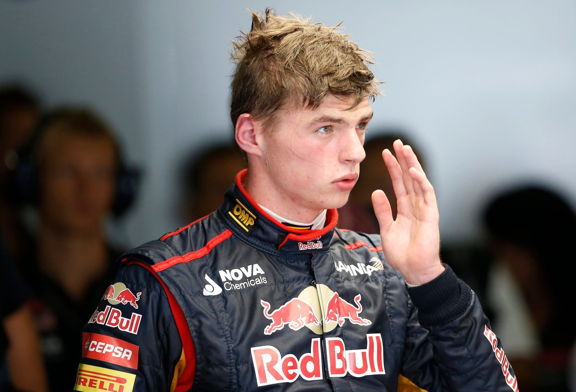 Toro Rosso Formula One driver Verstappen of the Netherlands returns to the garage after his car stalled on the track during the first practice session of the Japanese F1 Grand Prix at the Suzuka Circu