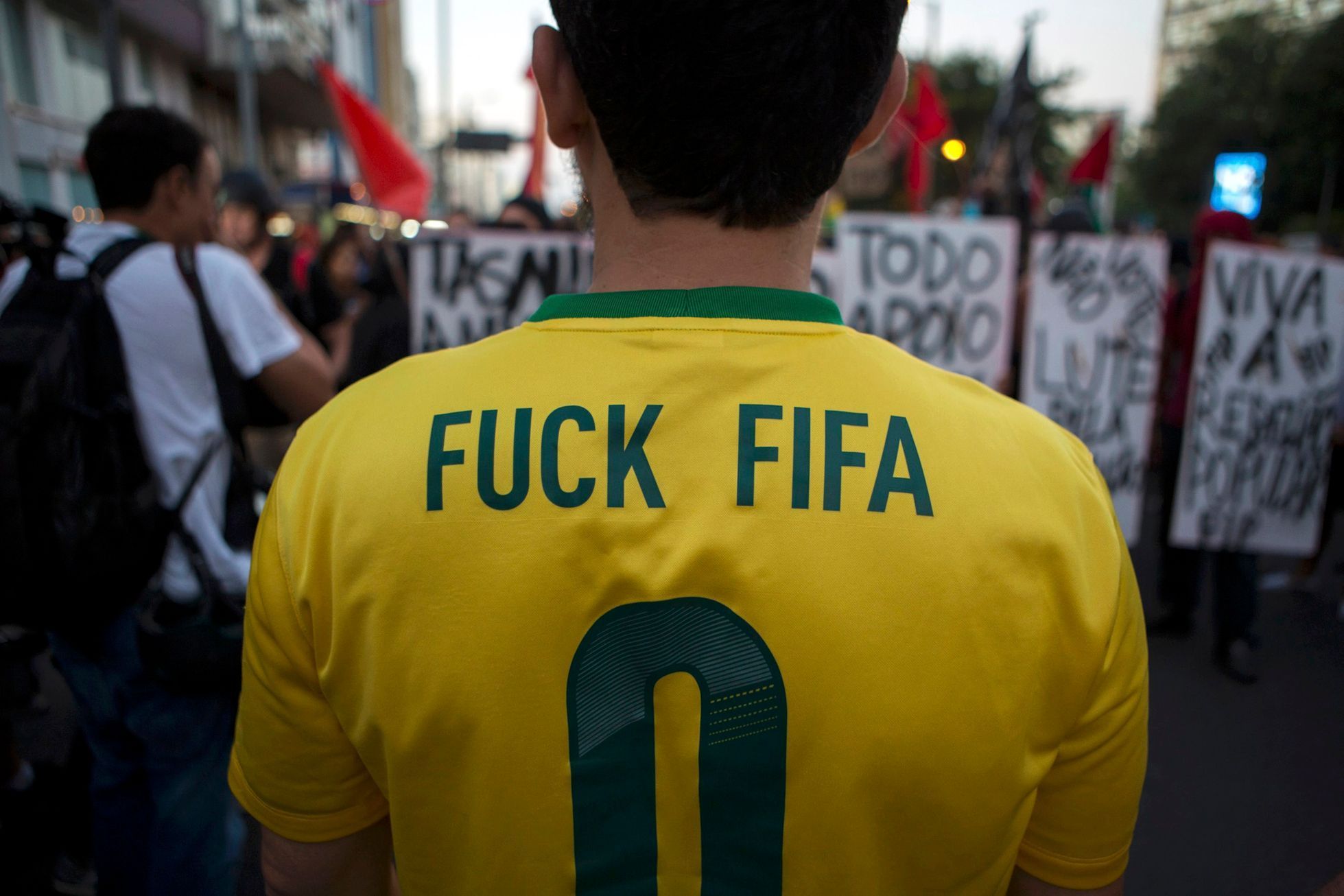 A protester wears a Brazilian national soccer jersey modified for a demonstration  in Rio de Janeiro
