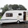 A man stands in a caravan parked outside a polling station during the referendum on Scottish independence in Strichen