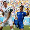 Uruguay's Jose Maria Gimenez fights for the ball with Italy's Marco Parolo during their 2014 World Cup Group D soccer match at the Dunas arena