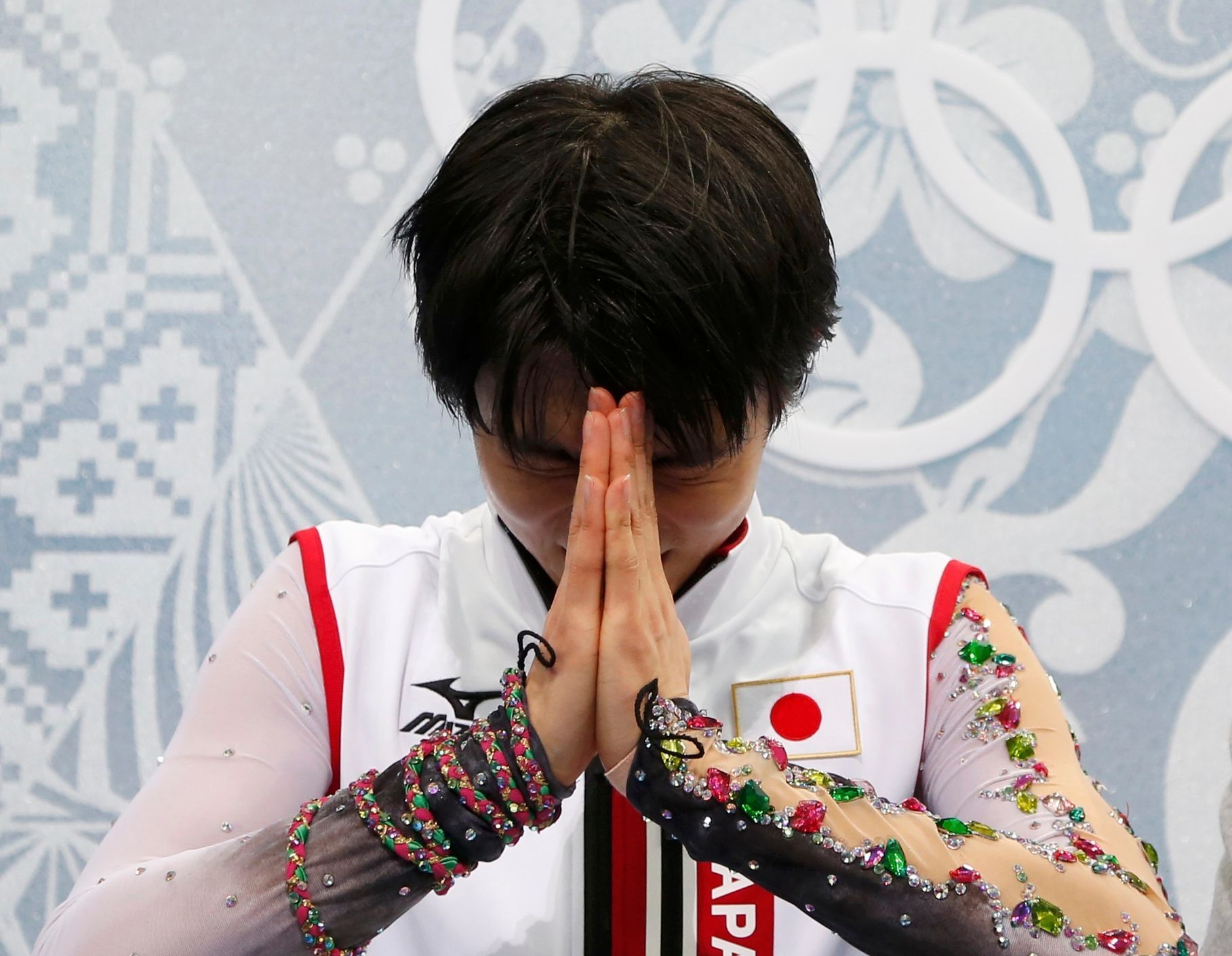 Japan's Yuzuru Hanyu  reacts in the &quot;kiss and cry&quot; area during the Figure Skating Men's Free Skating Program at the Sochi 2014 Winter Olympics