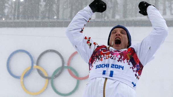 Czech Republic's Moravec celebrates during the flower ceremony after men's biathlon 15 km mass start event at 2014 Sochi Winter Olympics