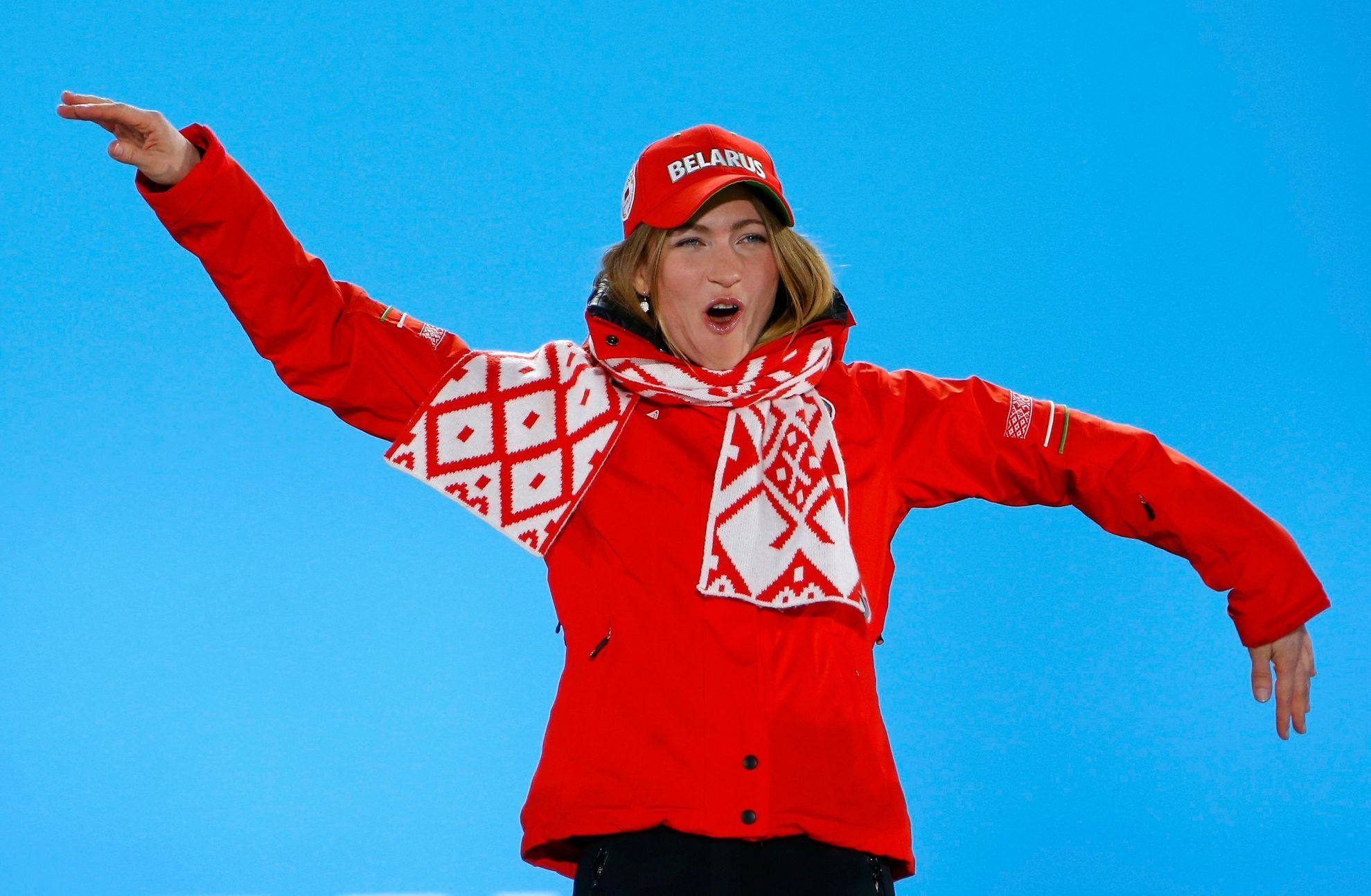 Domracheva celebrates during the victory ceremony for the women's biathlon individual 15 km event at the Sochi 2014 Winter Olympics in Sochi
