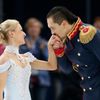 Maxim Trankov kisses the hand ofTatiana Volosozhar of Russia at the end of their performance during the Team Pairs Short Program at the Sochi 2014 Winter Olympics