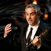 Alfonso Cuaron accepts the Oscar for best director for &quot;Gravity&quot; at the 86th Academy Awards in Hollywood