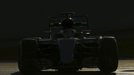 Mercedes F1 driver Lewis Hamilton takes a curve.