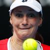 Makarova of Russia eyes the ball as she prepares to hit a return to Halep of Romania during their women's singles quarter-final at the Australian Open 2015 tennis tournament in Melbourne