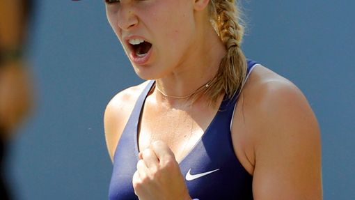 Canada's Eugenie Bouchard celebrates her win Olga Govortsova of Belarus during their match at the 2014 U.S. Open tennis tournament in New York
