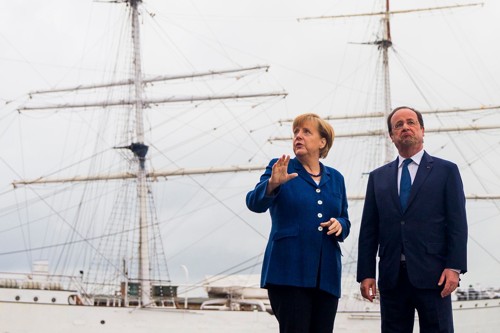 German Chancellor Merkel and French President Hollande pose for pictures in front of the tall ship Gorch Fock I, in Stralsund