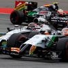 Force India Formula One driver Hulkenberg of Germany and McLaren Formula One driver Button of Britain drive through corner during German F1 Grand Prix at Hockenheim