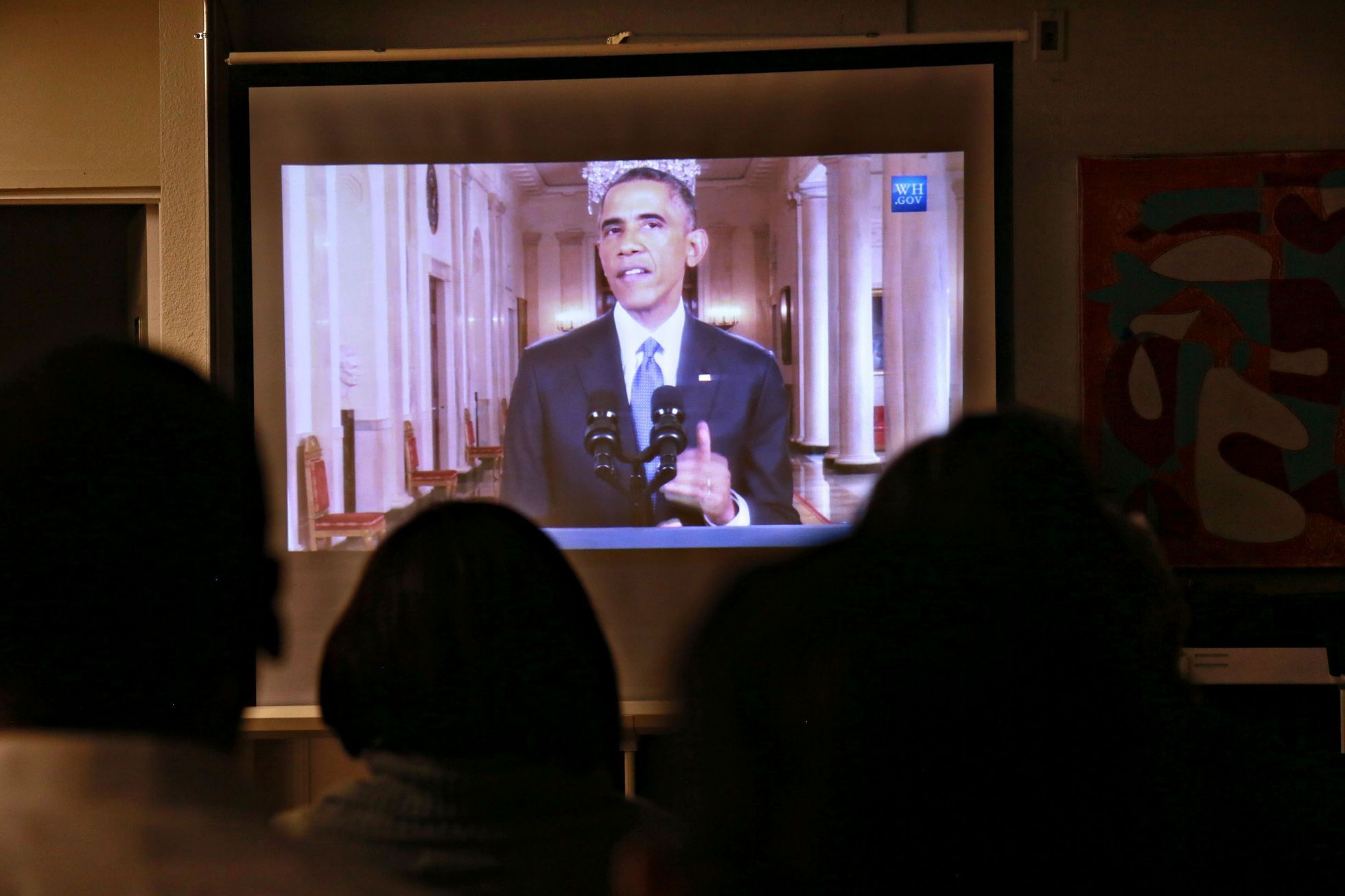 Imigranti v San Diegu sledují Obamův projev.