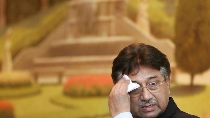 Pakistan's President Pervez Musharraf wipes his face while making a speech in Brussels January 21, 2008. Musharraf will seek support from the European Union and NATO on Monday at the start of a four-country trip to Europe where he is also expected to face tough questions over his rule. REUTERS/Yves Herman (BELGIUM)