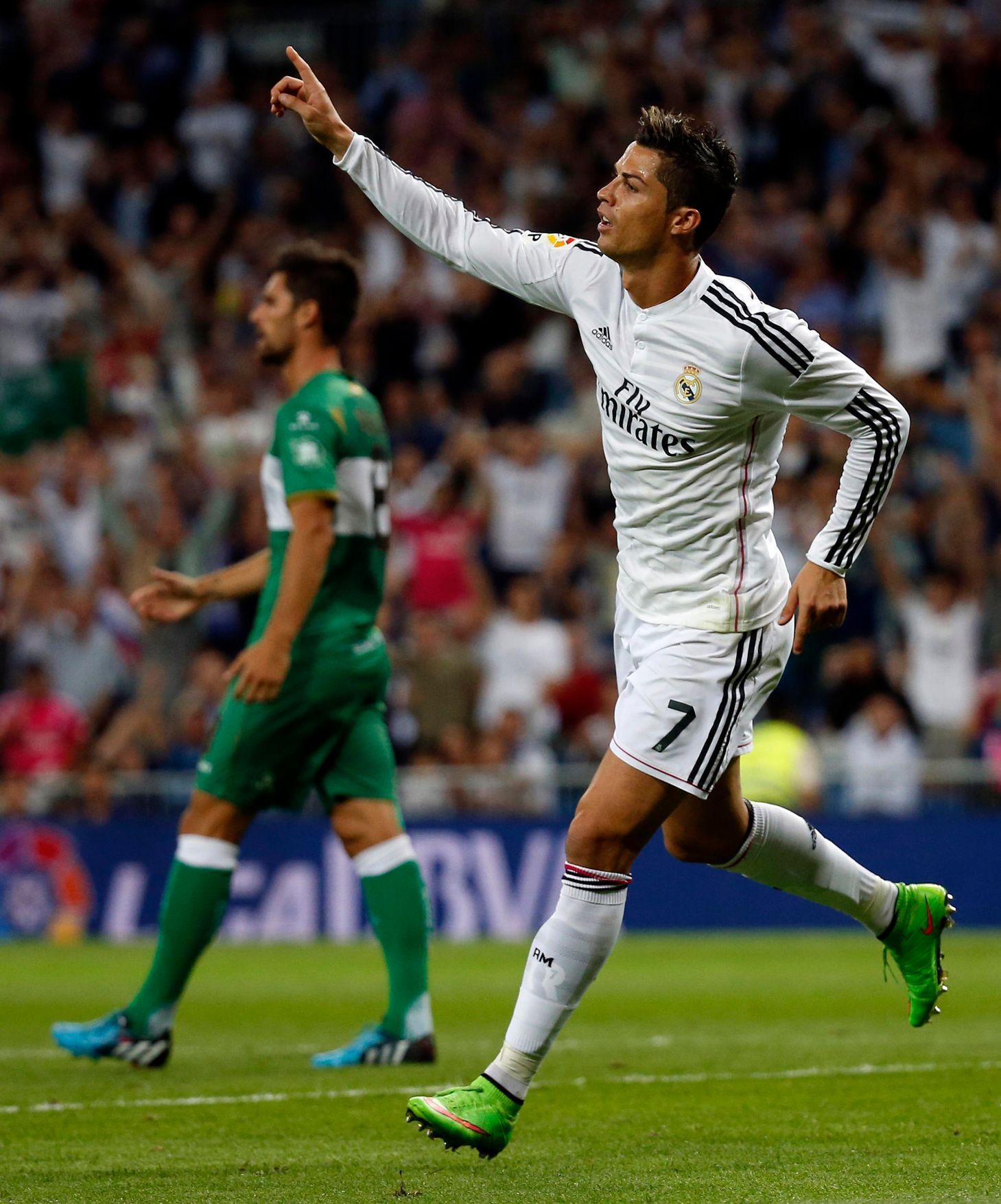 Real Madrid's Ronaldo celebrates after scoring his second goal against Elche during their Spanish first division soccer match in Madrid