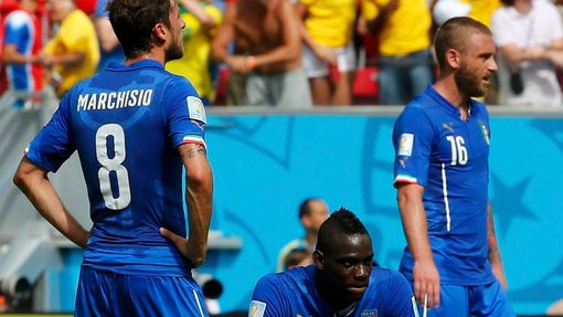 Italy's Claudio Marchisio, Balotelli and De Rossi react after a goal by Costa Rica's Bryan Ruiz during World Cup Group D soccer match at the Pernambuco arena