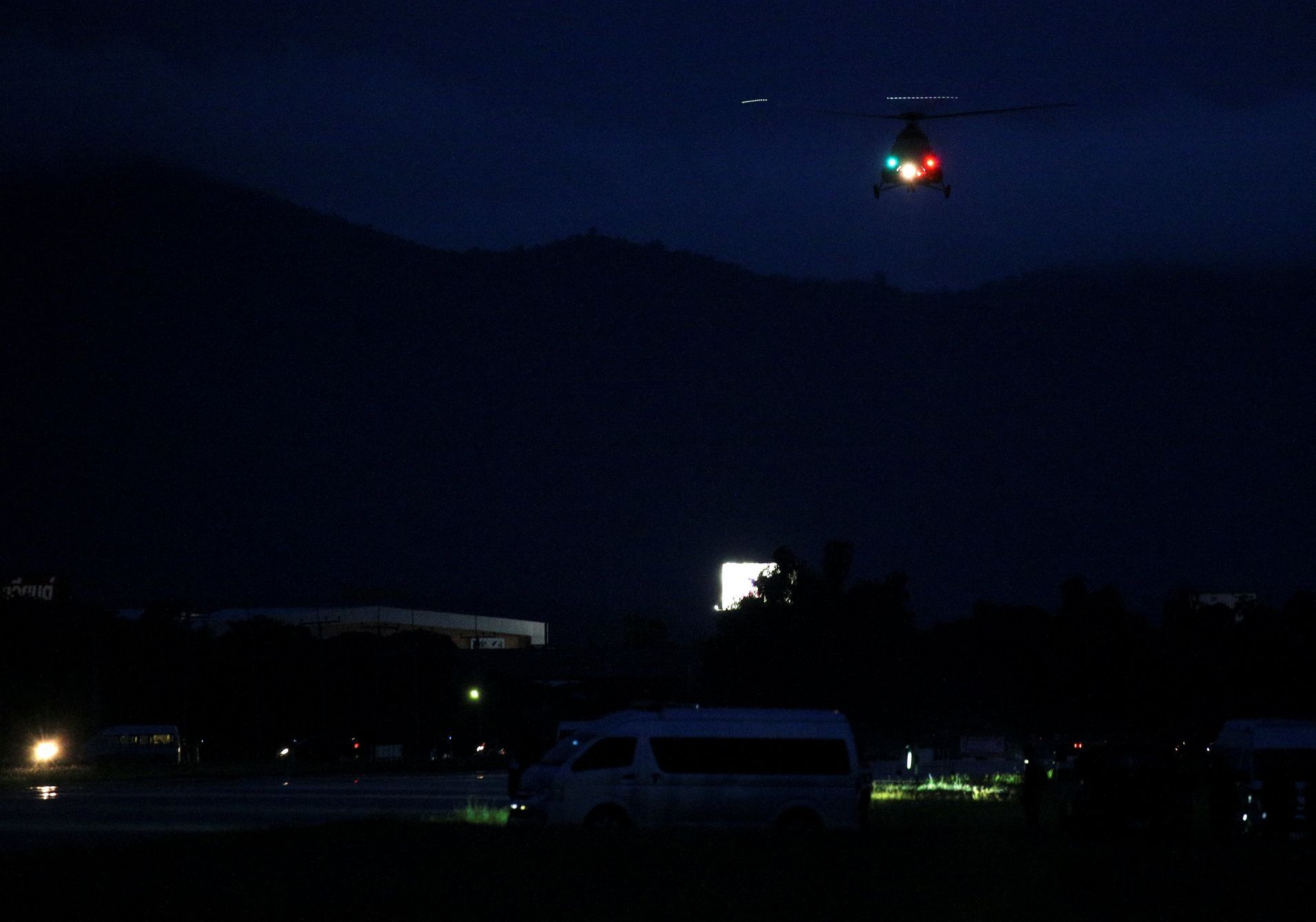 A military helicopter believed to be carrying rescued schoolboys takes off near Tham Luang cave complex in the northern province of Chiang Rai, Thailand