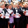 Actor Sylvester Stallone and cast members of the film &quot;The Expendables 3&quot; pose on the red carpet during the 67th Cannes Film Festival in Cannes