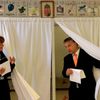 Hungary's Prime Minister Orban and his wife Levai  leave a polling booth to cast their ballot during European Parliamentary elections in Budapest