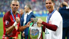 Portugal's Cristiano Ronaldo and Pepe celebrate with the trophy after winning Euro 2016