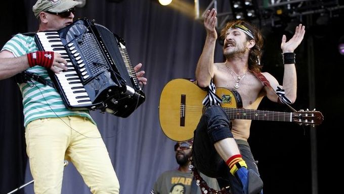 Gypsy punk in action. Eugene Hütz (with guitar) and Yuri Lemeshev during the Gogol Bordello´s show at the Sziget festival in Budapest