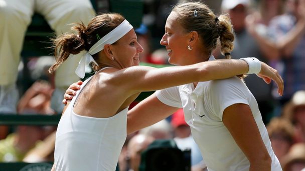 Petra Kvitova of the Czech Republic embraces Lucie Safarova of the Czech Republic after defeating her in their women's singles semi-final tennis match at the Wimbledon Tennis Championships, in London