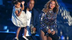 Jay-Z presents the Video Vanguard Award to Beyonce as he holds their daughter Ivy Blue during the 2014 MTV Video Music Awards in Inglewood