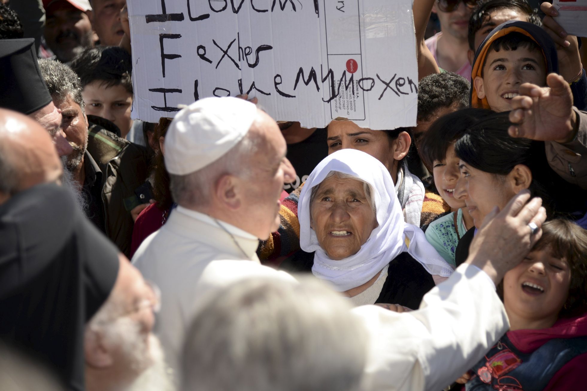Pope Francis greets migrants and refugees at Moria refugee camp near the port of Mytilene, on the Greek island of Lesbos