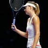 Maria Sharapova of Russia reacts after losing a point against Petra Kvitova of the Czech Republic at the Singapore Indoor Stadium