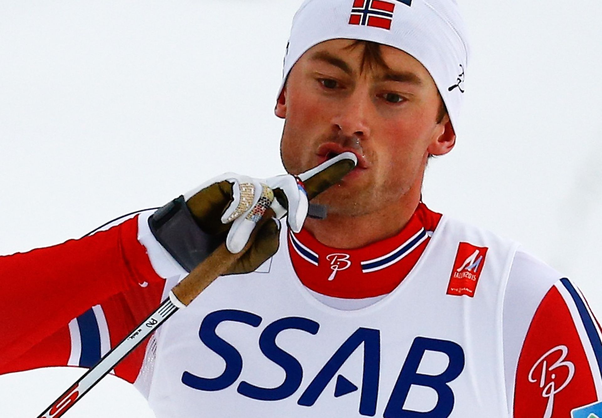 Norway's Northug crosses the finish line ahead of Sweden's Halfvarsson to win the men's cross country free/classic 4 x 10 km relay final at the Nordic World Ski Championships in Falun