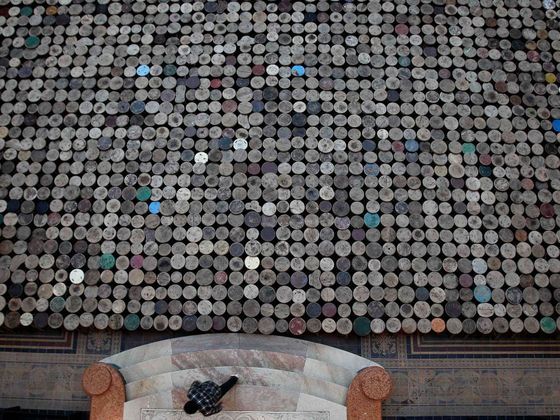 Aj Wej-wej: Evidence Man walks up steps next to installation by Chinese artist Ai Weiwei as part of the exhibition 'Evidence' at Martin-Gropius Bau in Berlin