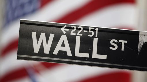 A street sign stands outside the New York Stock Exchange on Wall Street in New York in this file photo taken August 19, 2011. Wall Street is ramping up a campaign against