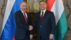 Russia's President Putin shakes hands with Hungarian Prime Minister Orban during their meeting in Budapest