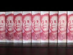 Čínské bankovky s Mao-Ce tungem.
