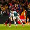 Manchester City's Alvaro Negredo is challenged by Barcelona's Gerard Pique during their Champions League round of 16 first leg soccer match at the Etihad Stadium in Manchester