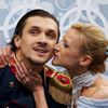 Russia's Tatiana Volosozhar kisses Maxim Trankov during the Figure Skating Pairs Short Program at the Sochi 2014 Winter Olympics