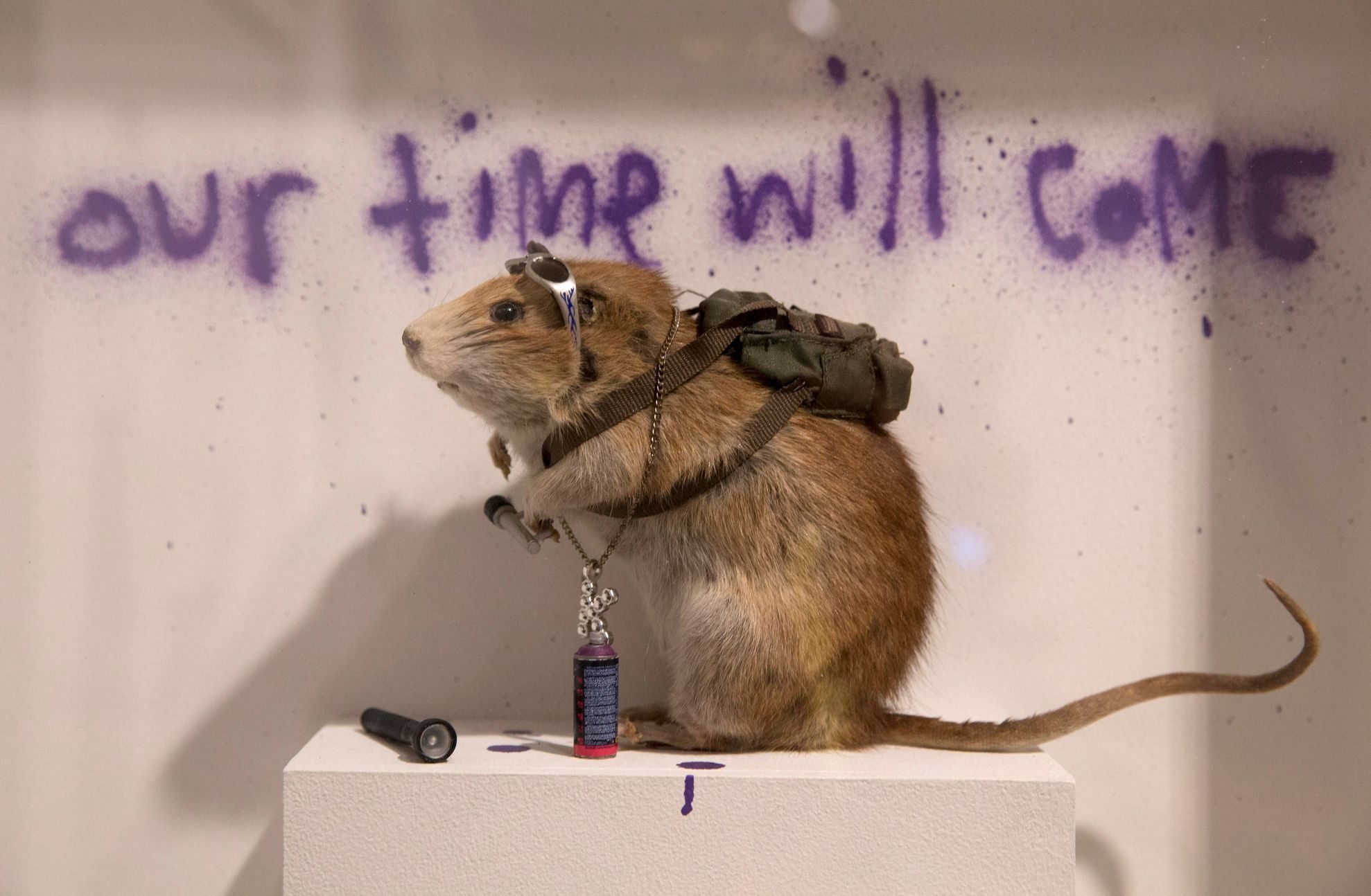 A rat forms part of work entitled &quot;Banksus Militus Vandalus&quot; installation at Banksy: The Unauthorised Retrospective exhibition at Sotheby's S2 Gallery in London