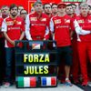 Members of Ferrari Formula One team pose with a sign in support of Marussia Formula One driver Bianchi of France before the first Russian Grand Prix in Sochi