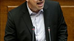 Greek PM Tsipras addresses lawmakers during a parliamentary session in Athens