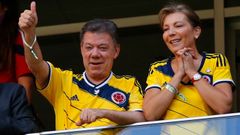 Colombia's President Santos and his wife gesture during the team's 2014 World Cup Group C soccer match against Ivory Coast in Brasilia